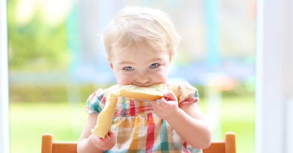 baby eating bread